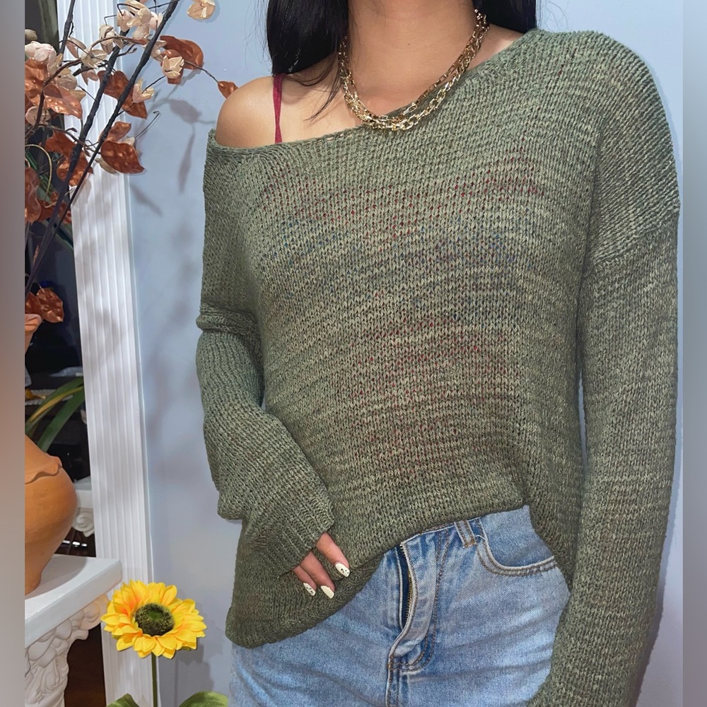 Open knit loose fitting sweater with a crossed-open back